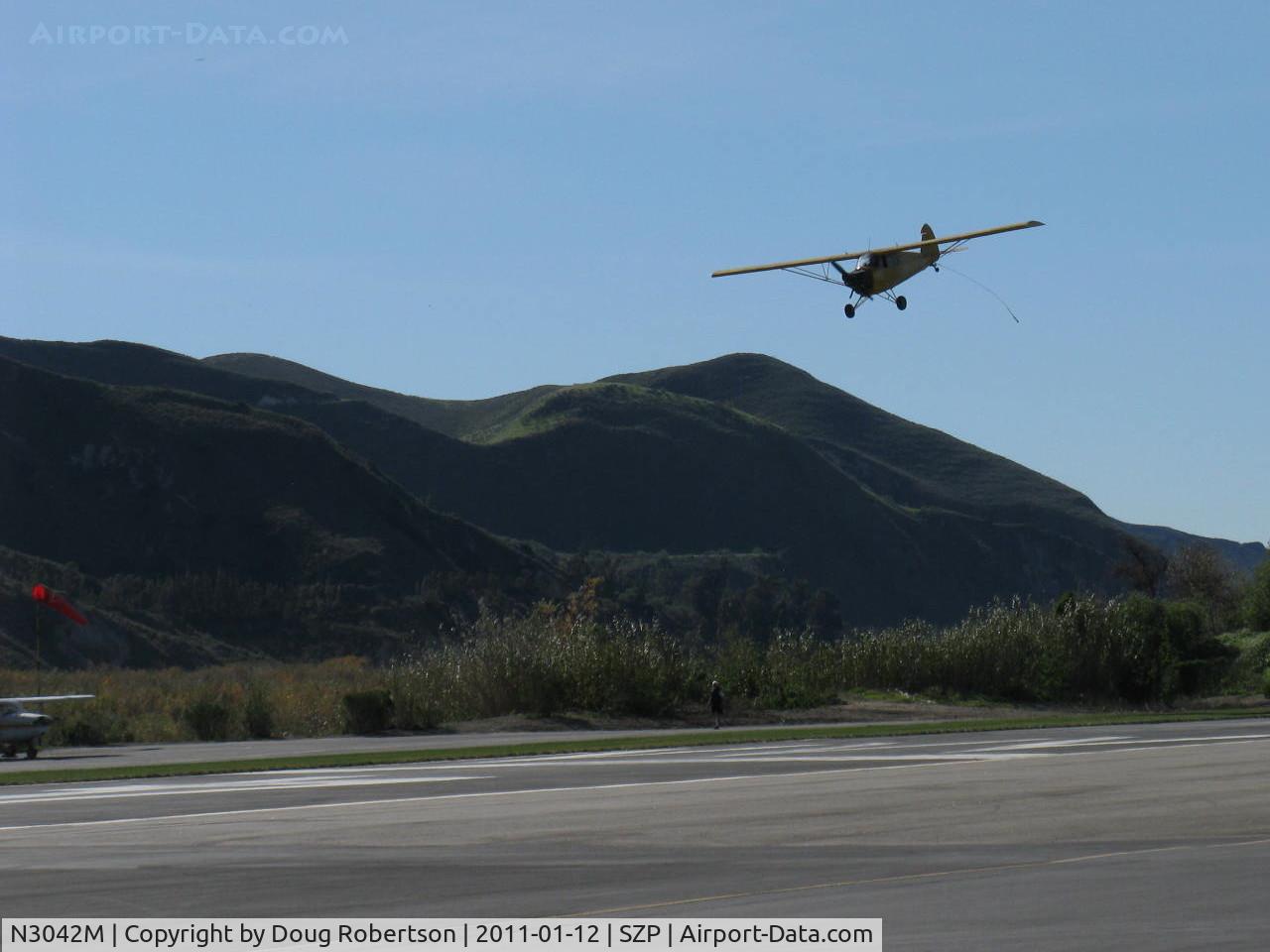 N3042M, 1947 Piper PA-12 Super Cruiser C/N 12-1734, 1947 Piper PA-12 SUPER CRUISER, Lycoming O-360 180 Hp upgrade (field approval), Restricted class banner tow, diving for the pickup line rigged on Rwy 04R grass, with trailing grapple hook