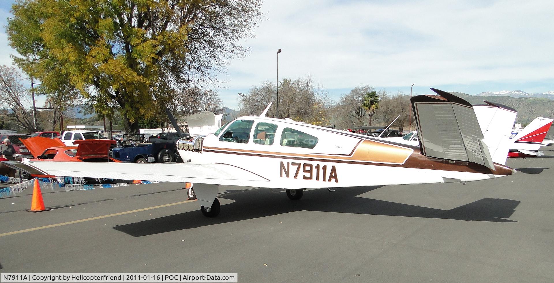 N7911A, 1964 Beech S35 Bonanza C/N D-7490, Cowling open to show engine