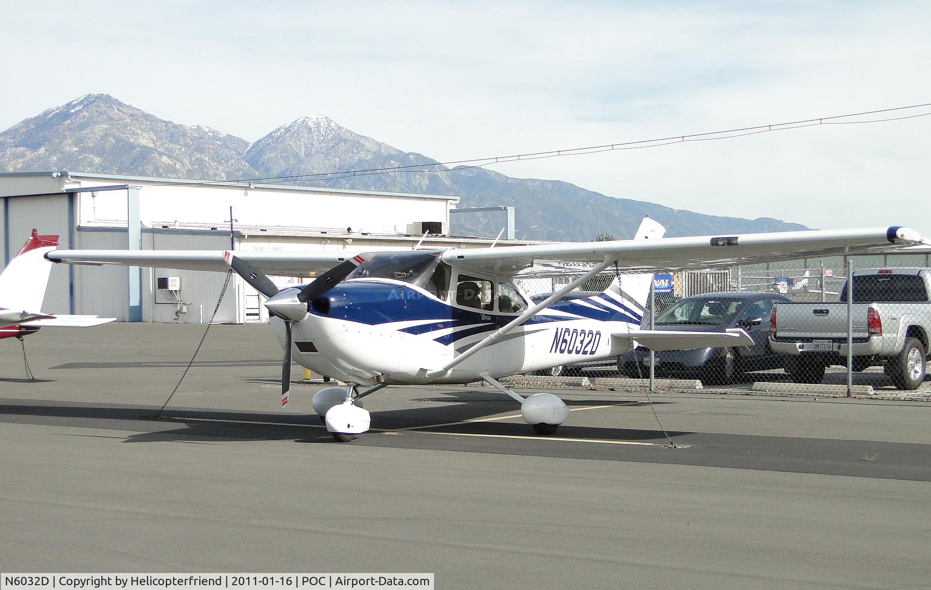 N6032D, 2006 Cessna 182T Skylane C/N 18281820, Parked against the fence in transient parking area