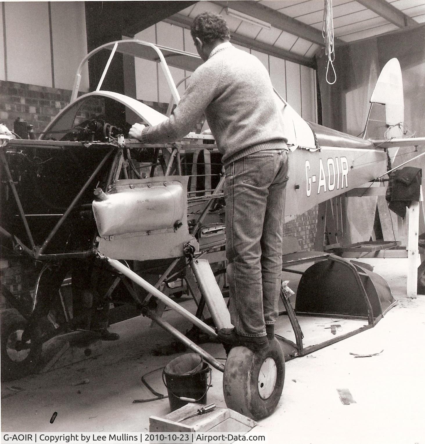 G-AOIR, 1943 Thruxton Jackaroo C/N 82882, G-AOIR at Meppershall, when operated by The Stevenage Flying Group. A steel framed cabin had just been fitted to replace the rapidly deteriorating wooden original. Les Smith, who later purchased the aircraft, is working on the fuselage.