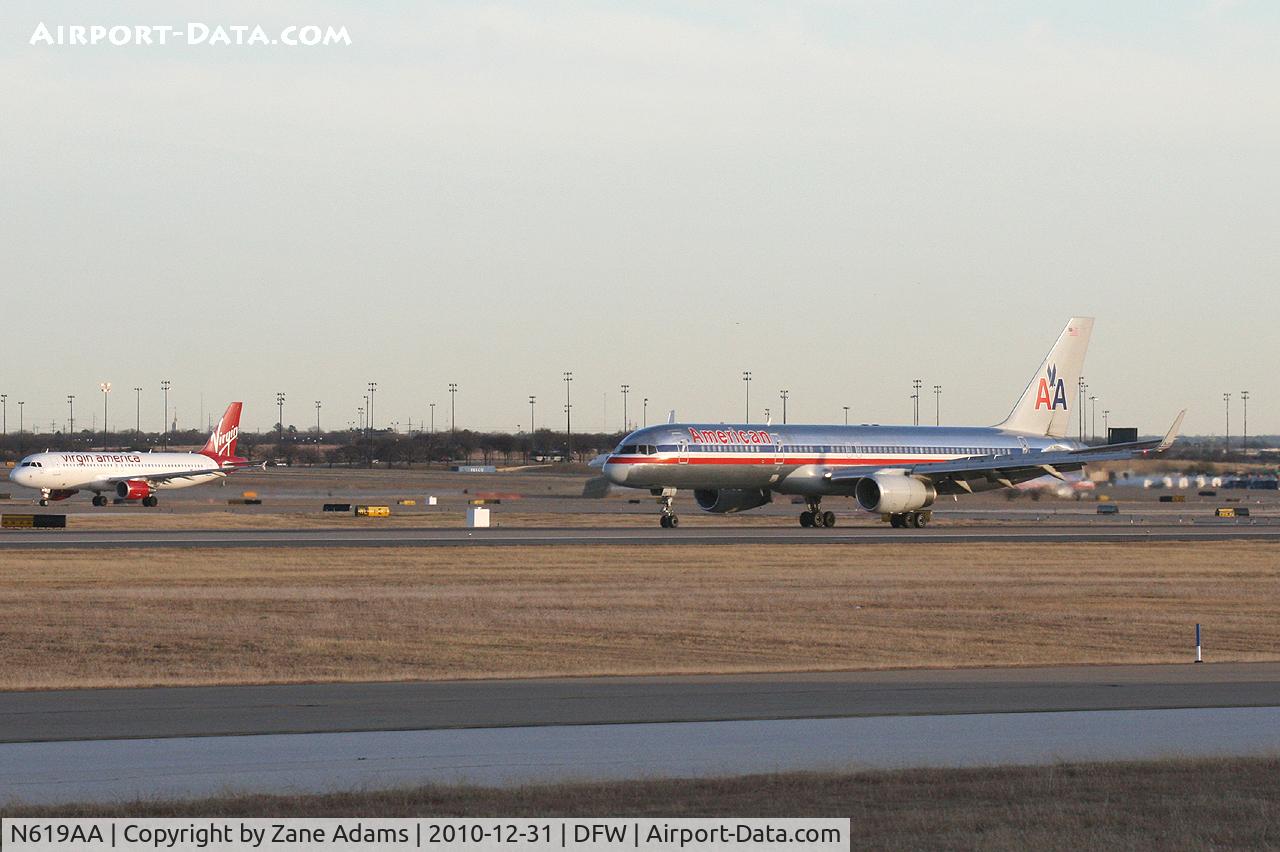 N619AA, 1990 Boeing 757-223 C/N 24577, American Airlines 757 arrives on runway 36L while Virgin America departs on 36R.