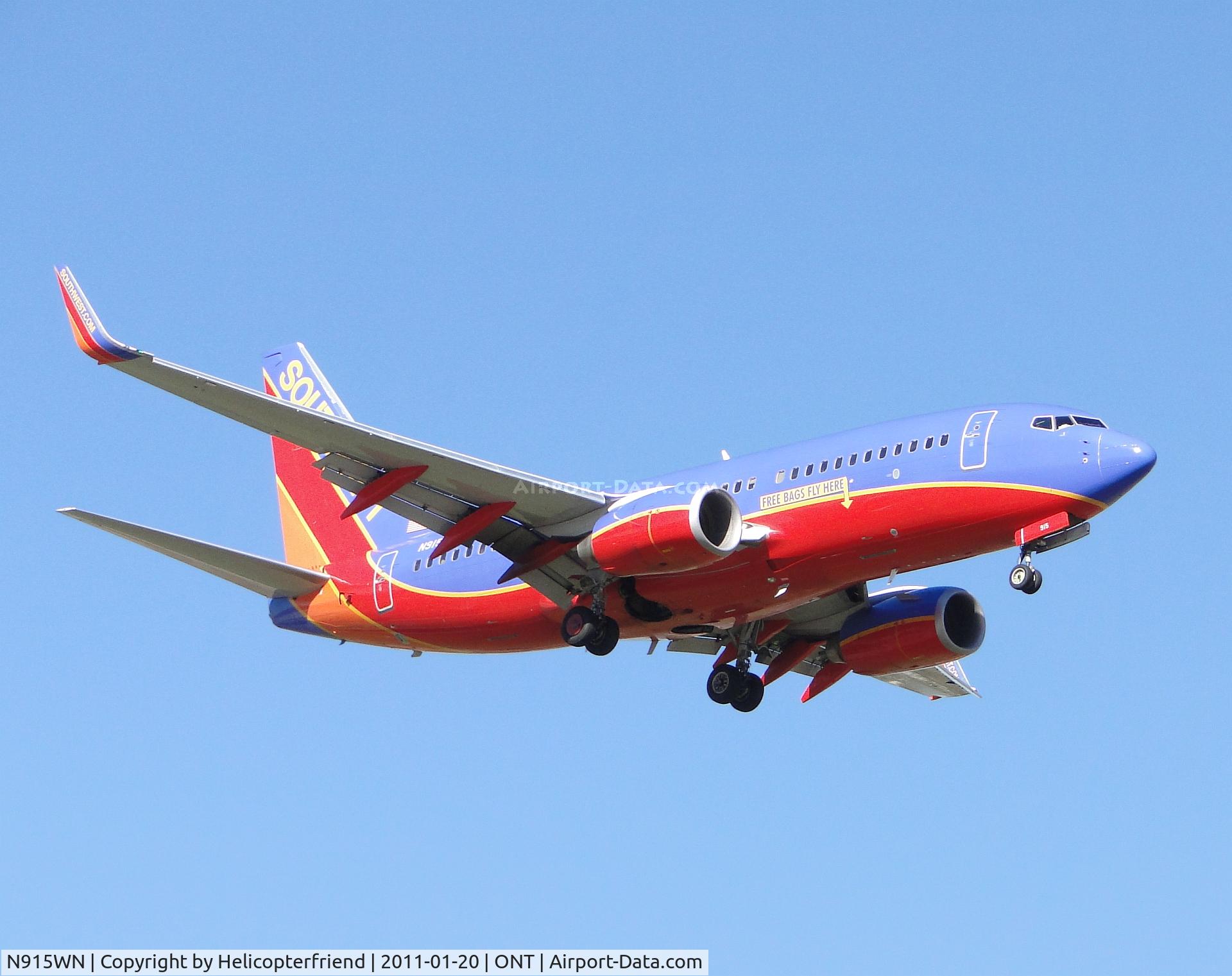 N915WN, 2008 Boeing 737-7H4 C/N 36888, On final to runway 8 and advetising where bags can fly free
