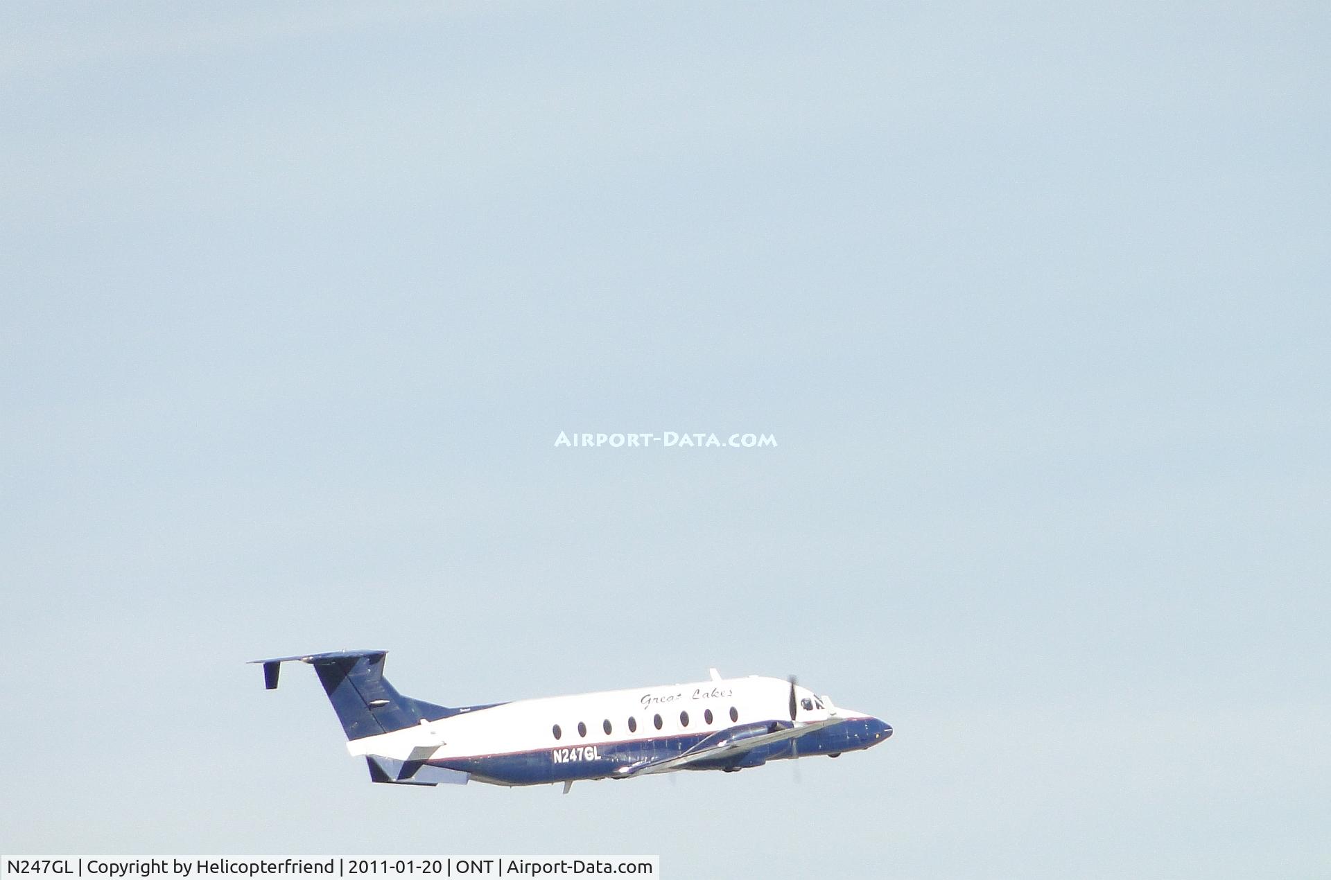 N247GL, 1996 Beech 1900D C/N UE-247, Taking off from runway 8 and heading eastbound