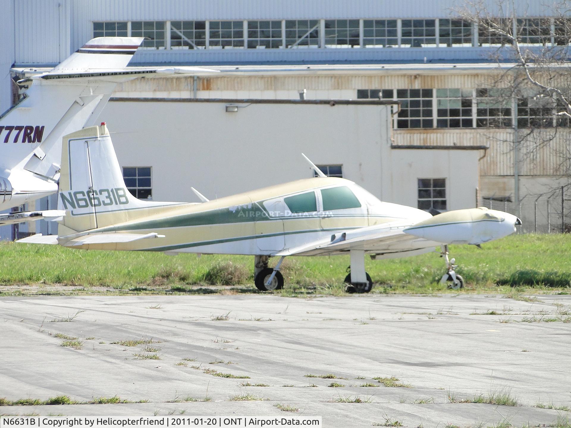 N6631B, 1958 Cessna 310B C/N 35731, Parked near the grassy area on the southside