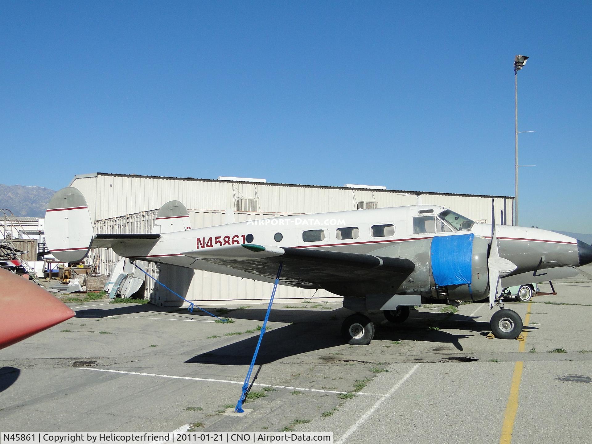 N45861, 1943 Beech TC-45J C/N 46-7236, Parked and engines covered on the eastside parking area