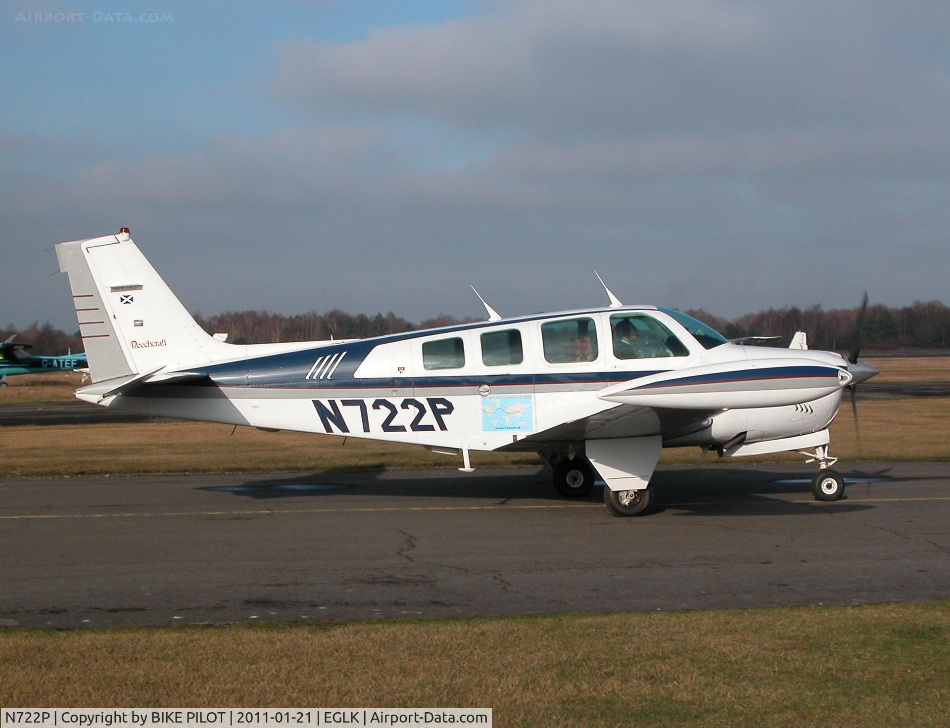 N722P, 1985 Beech A36 Bonanza 36 C/N E-2219, Visiting Bonanza taxying past the cafe, This a/c flew around the World in 2009.