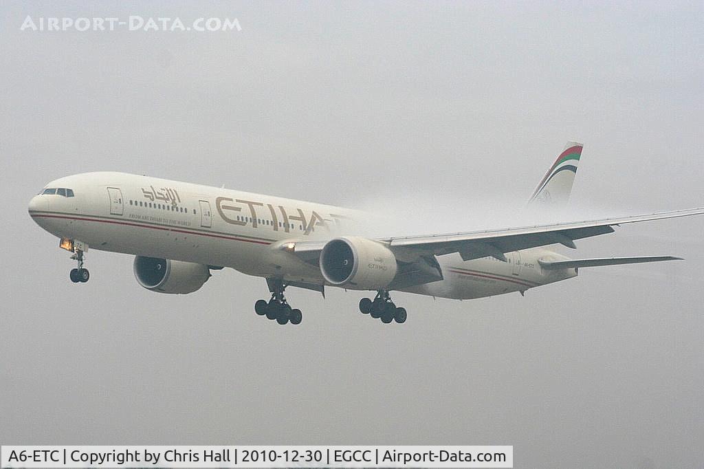 A6-ETC, 2005 Boeing 777-3FX/ER C/N 34599, Etihad Airways coming through the fog on approach to RW23R