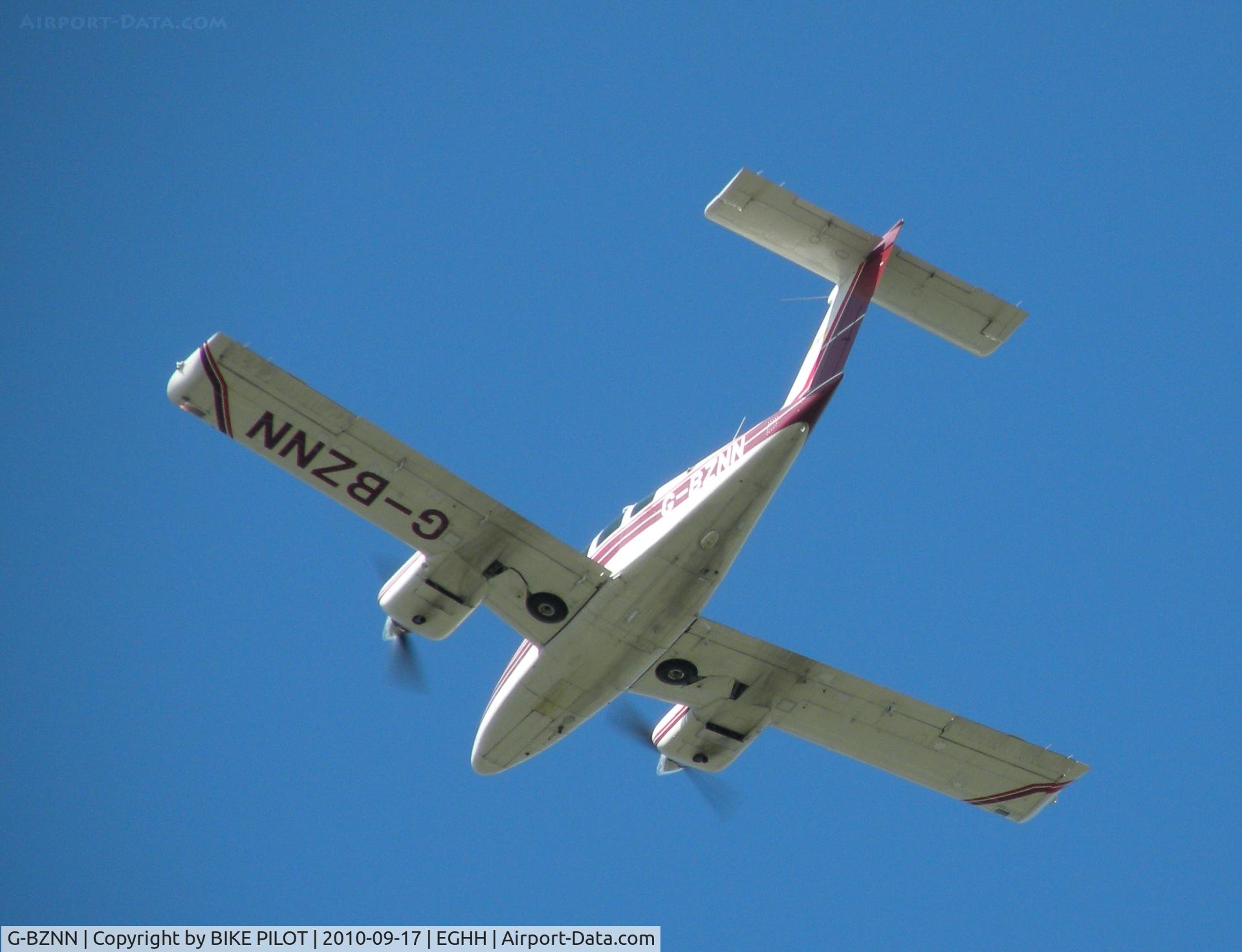 G-BZNN, 1980 Beech 76 Duchess C/N ME-343, Duchess in the overhead