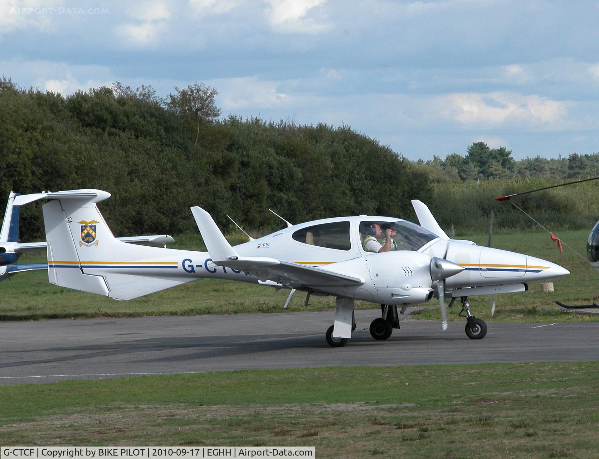 G-CTCF, 2005 Diamond DA-42 Twin Star C/N 42.045, Taxying past the Flying Club to rwy 26