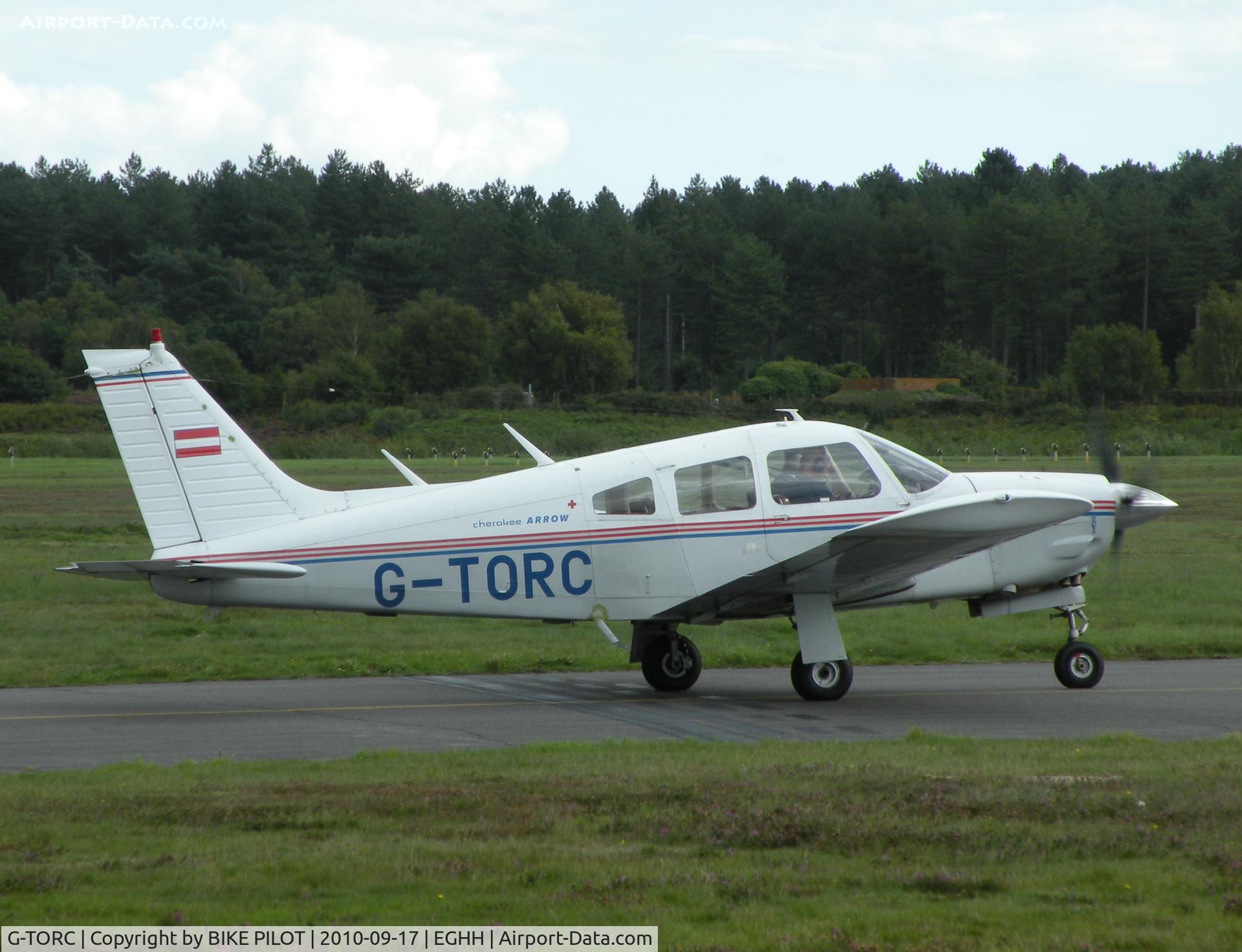 G-TORC, 1974 Piper PA-28R-200 Cherokee Arrow C/N 28R-7535036, Arrow II taxying past the Flying Club