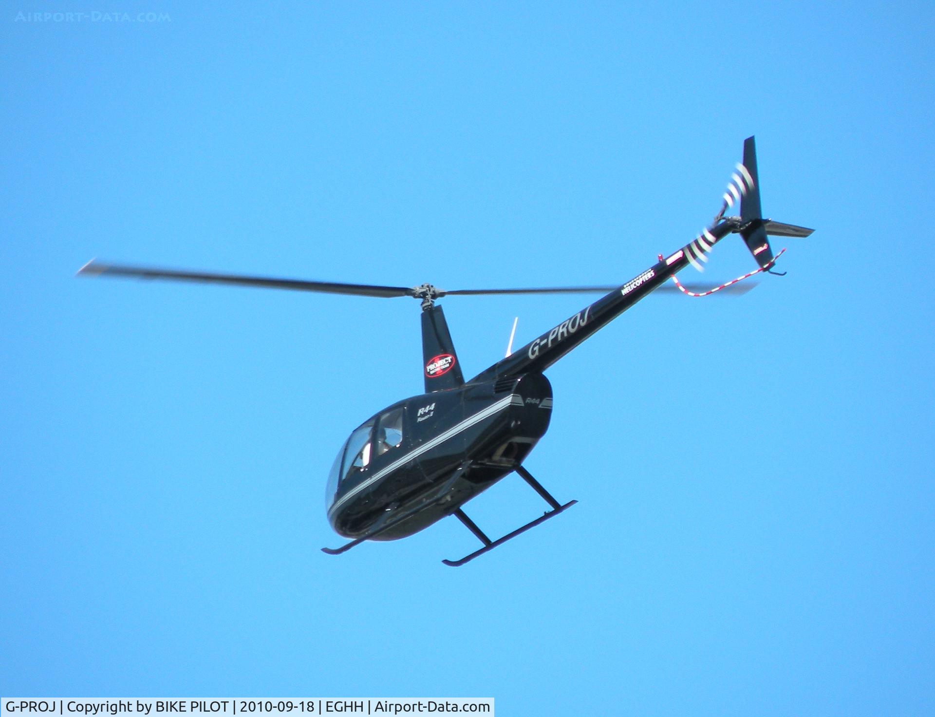 G-PROJ, 2007 Robinson R44 Raven II C/N 11695, R44 over flying the Flying Club