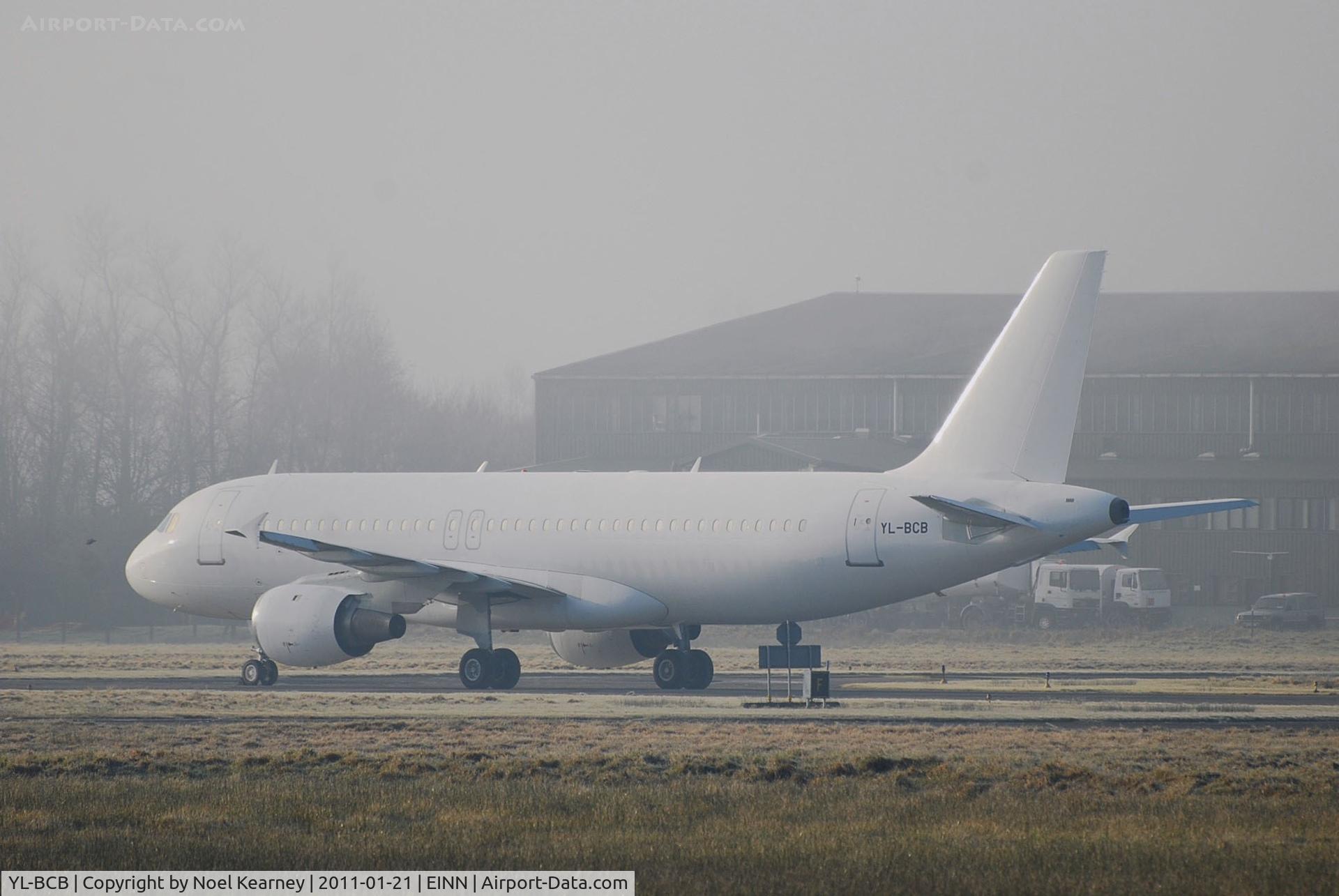 YL-BCB, 1997 Airbus A320-211 C/N 726, Stored - Slowly appearing out of the freezing fog on a bitterly cold January day.