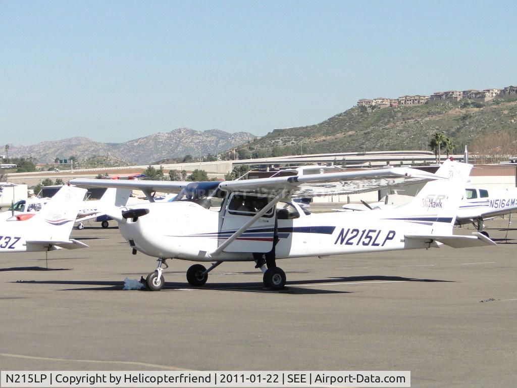 N215LP, 2002 Cessna 172S C/N 172S9215, After preflight walk around, student and instructor are getting in for flight