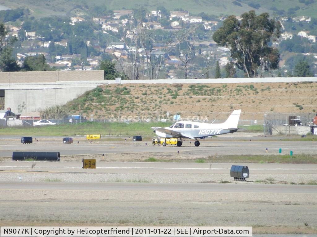 N9077K, 1977 Piper PA-28-161 C/N 28-7816188, Just landed on runway 27R and rolling out