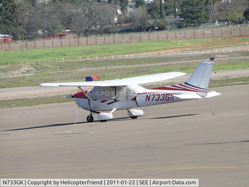 N733GK, 1976 Cessna 172N C/N 17268283, Tied down and covered by the Admin Building