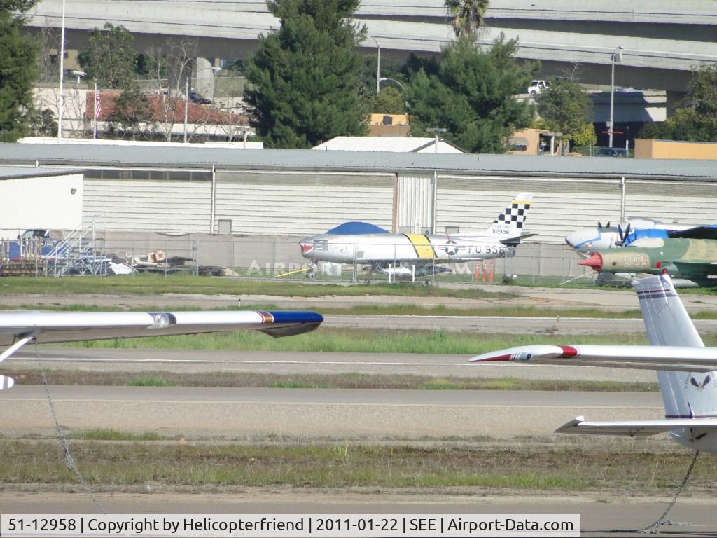 51-12958, 1951 North American F-86F Sabre C/N 172-249, Paper Tiger is covered up and parked in the back area of the San Diego Aerospace Museum