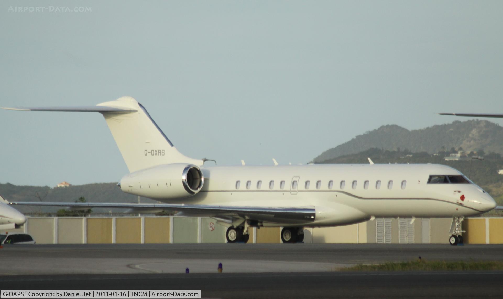 G-OXRS, 2009 Bombardier BD-700-1A10 Global Express C/N 9351, G-OXRS park on the main ramp at TNCM