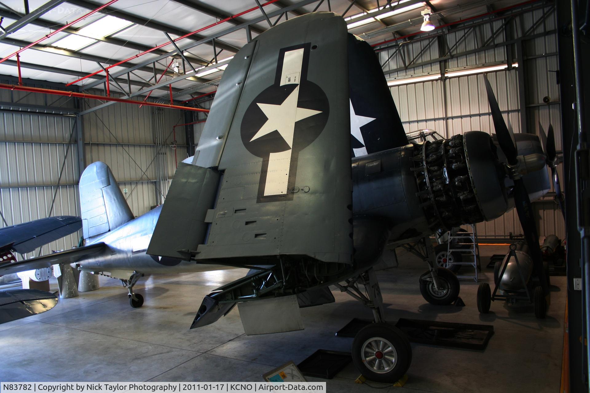N83782, 1942 Vought F4U-1 Corsair C/N 3884 (Bu 17799), Corsair inside the Navy hangar. This is just 1 of the birds used in the TV series Black Sheep Squadron.