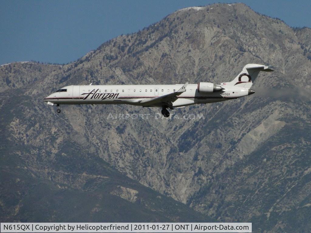 N615QX, 2002 Bombardier CRJ-701 (CL-600-2C10) Regional Jet C/N 10065, On final to runway 26R