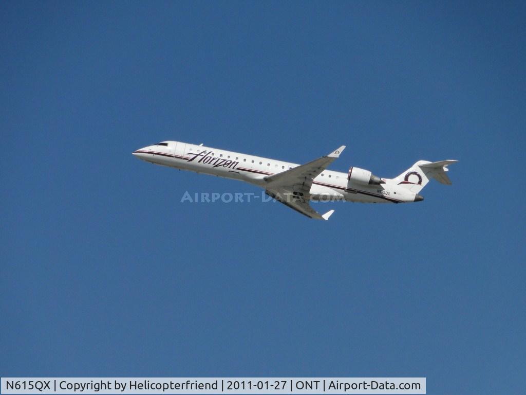 N615QX, 2002 Bombardier CRJ-701 (CL-600-2C10) Regional Jet C/N 10065, 50 minutes after touch down, passengers were loaded and ship took off from runway 26R