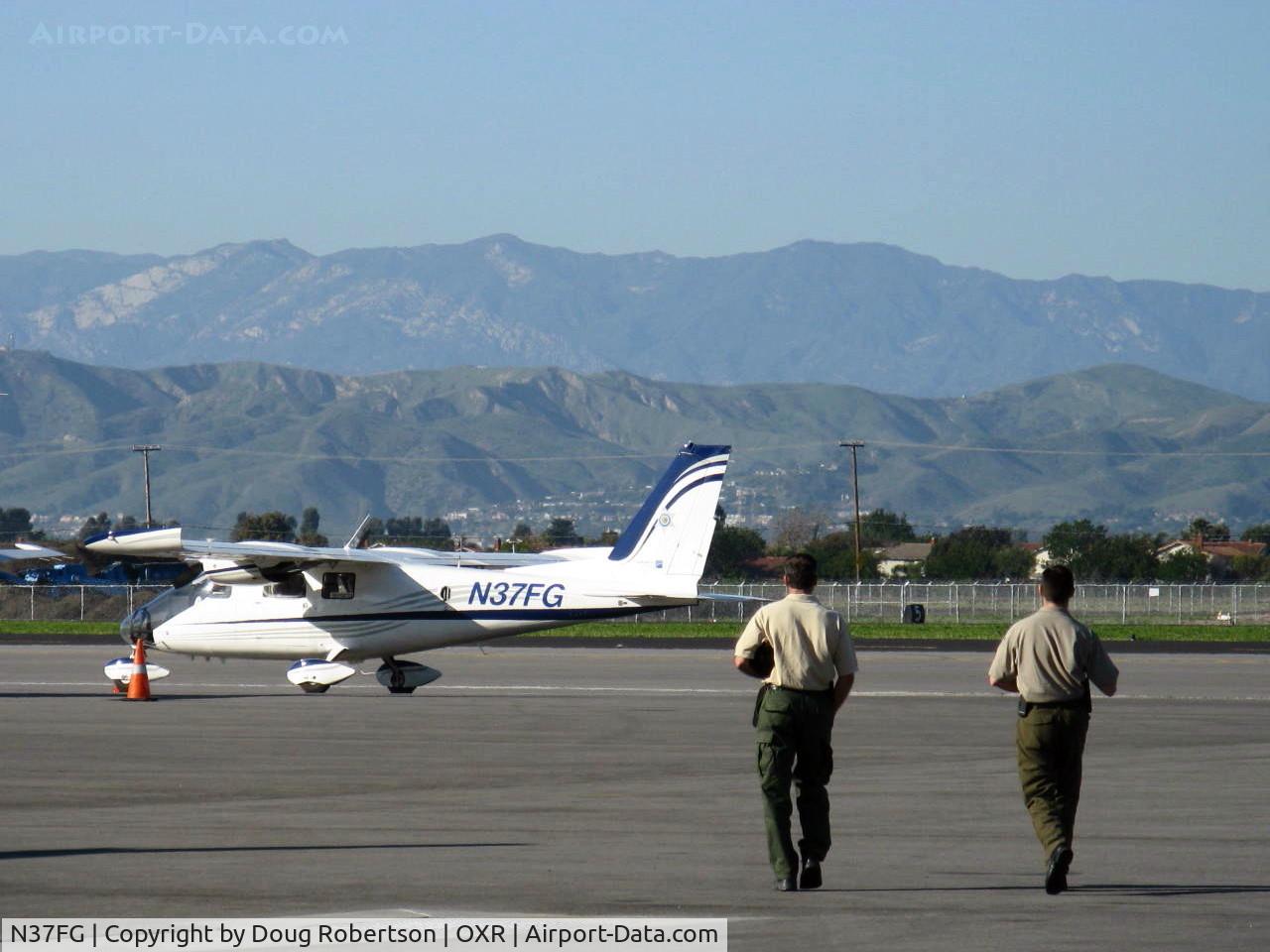 N37FG, Vulcanair P-68 Observer 2 C/N 446-33/OB2, 2008 Vulcanair Spa P68-OB2 OBSERVER, two Lycoming IO-360-A1B6 200 Hp each. Crew walking to aircraft. State of California operates three of these aircraft.