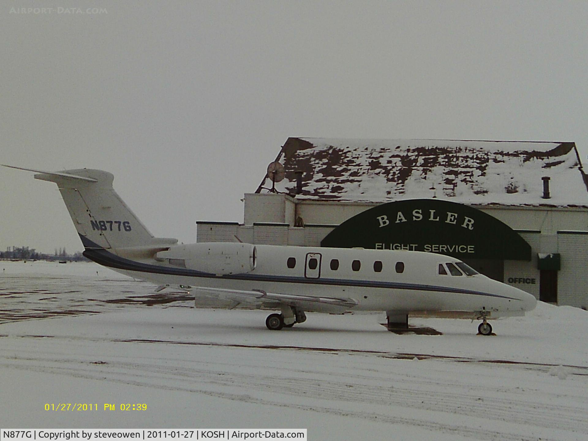 N877G, 1995 Cessna 650 C/N 650-7063, snowy cold Wisconsin winter ramp ops at Basler