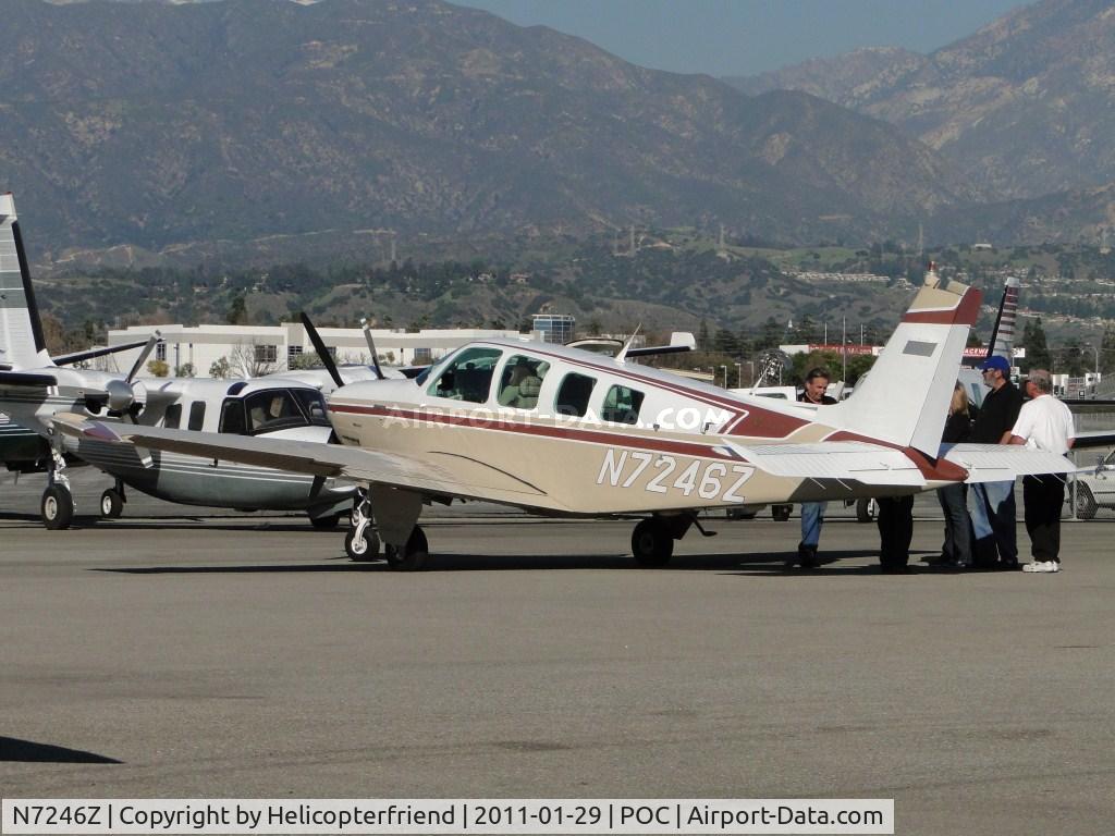N7246Z, 1985 Beech A36 Bonanza 36 C/N E-2266, Appears to be a discussion between several people while ship is parked at Howard Aviation