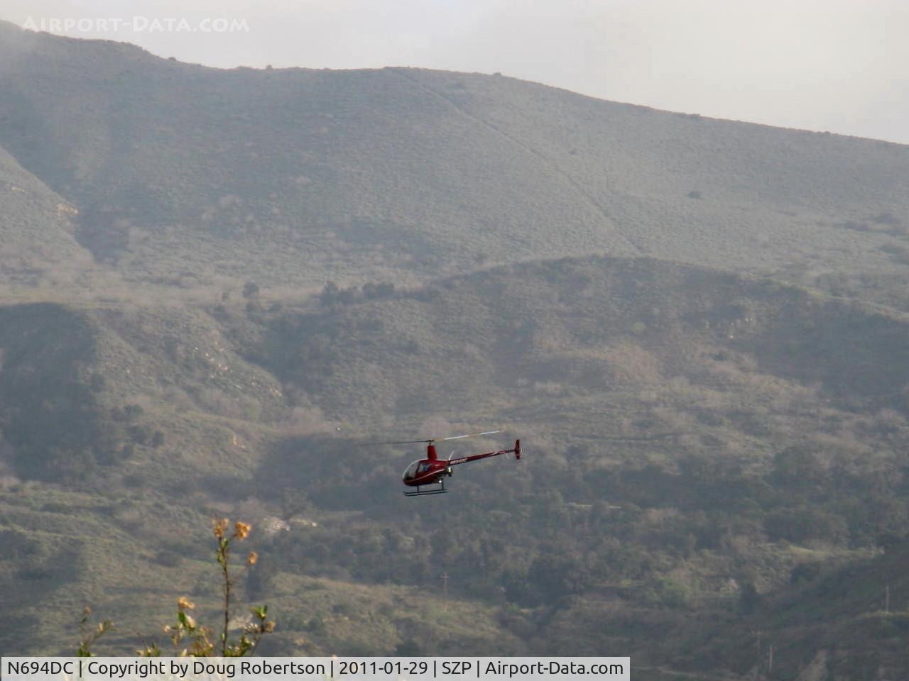 N694DC, 2004 Robinson R22 Beta C/N 3573, 2004 Robinson R22 BETA II, Lycoming O-360 derated to 131 Hp, departure over Santa Clara River route under the fixed-wing traffic pattern altitude