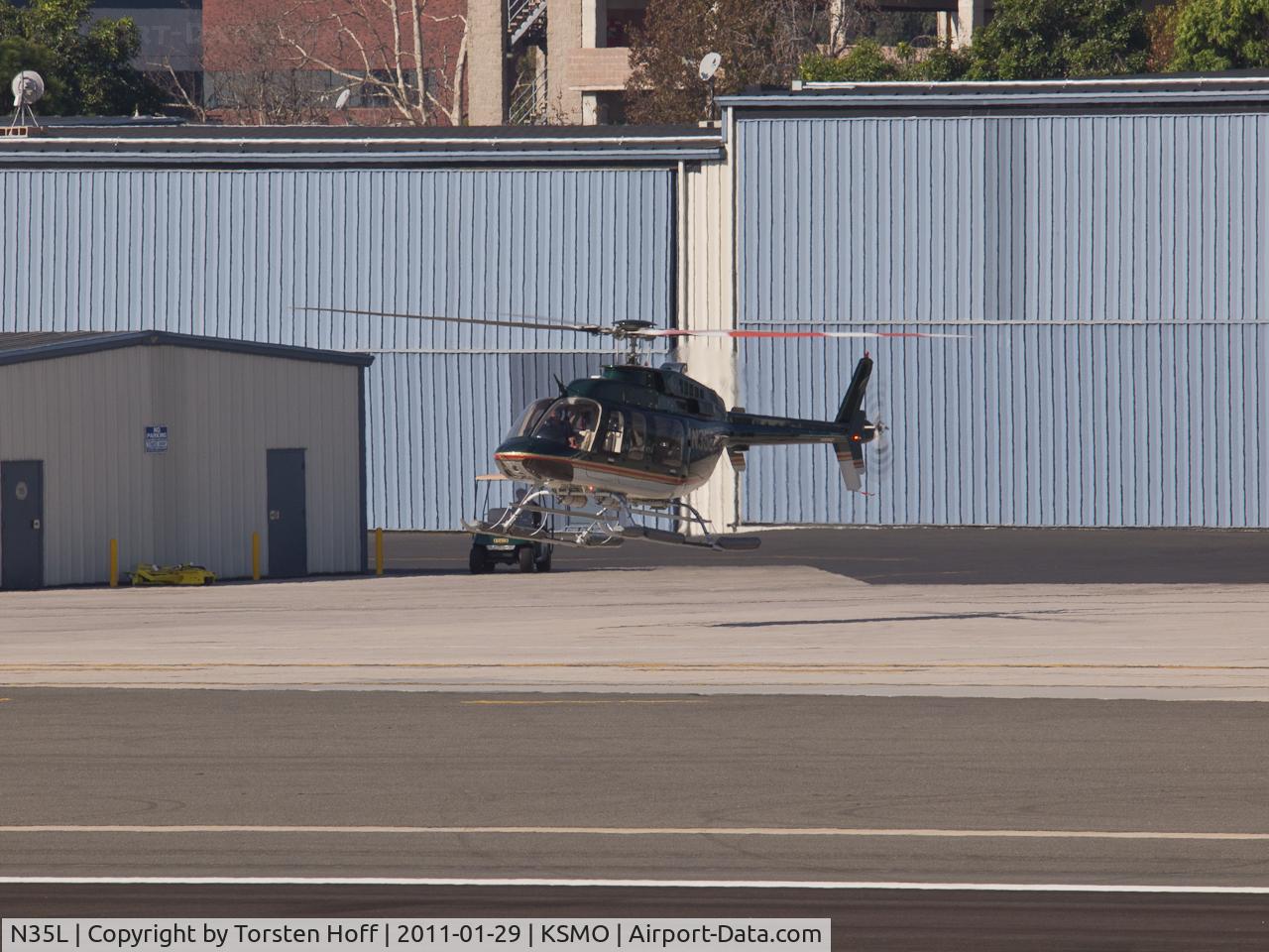 N35L, 2000 Bell 407 C/N 53402, N35L about to touch down after arriving on RWY 21