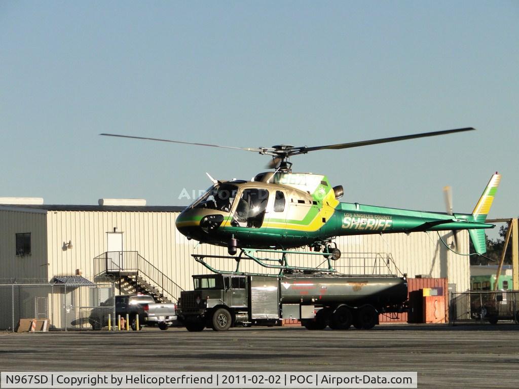 N967SD, 2003 Eurocopter AS-350B-2 Ecureuil C/N 3678, After dropping off a passenger, air taxiing to taxiway Sierra waiting for aircraft to pass before westbound departure
