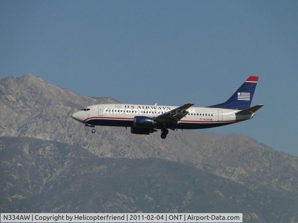 N334AW, 1987 Boeing 737-3Y0 C/N 23748, On final for runway 26R