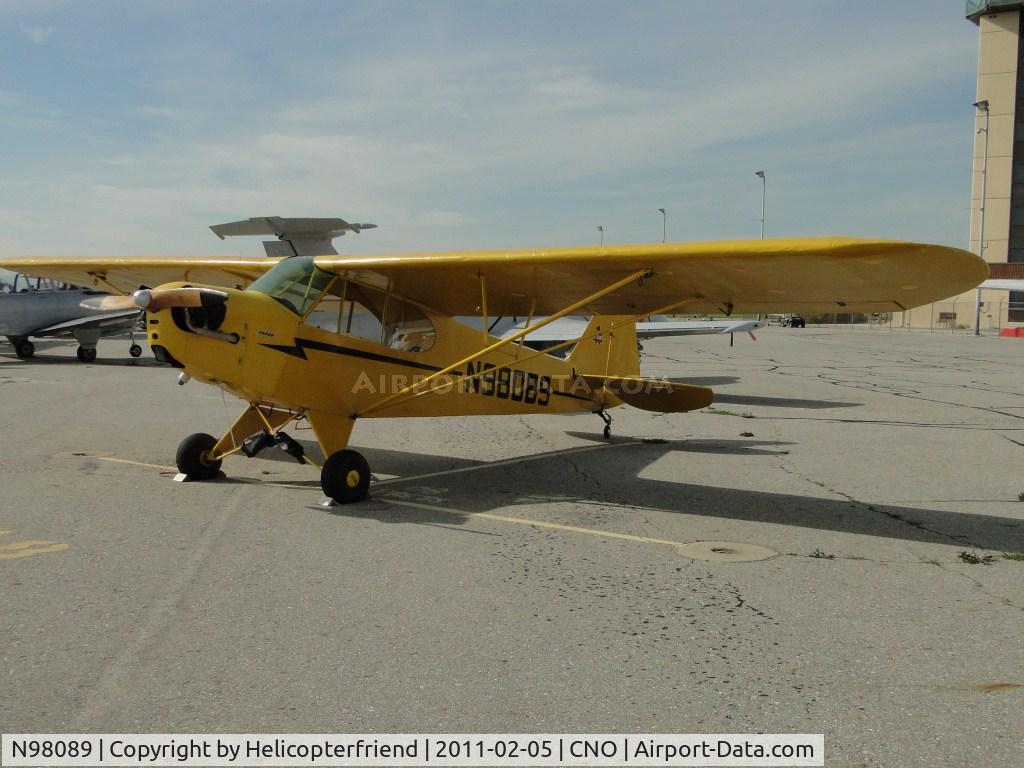 N98089, 1946 Piper J3C-65 Cub C/N 18259, Parked in the area north of runway 26R and west of the Tower