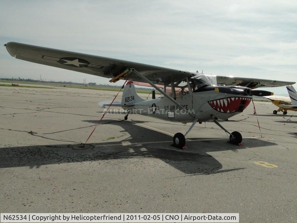 N62534, Cessna 305C (0-1E) C/N 23656, Parked in the area north of runway 26R and west of the Tower