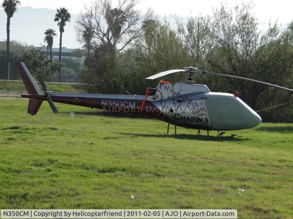 N350CM, 1989 Aerospatiale AS-350B-1 Ecureuil C/N 2265, Parked, Covered up and tied down in the southeast grassy area