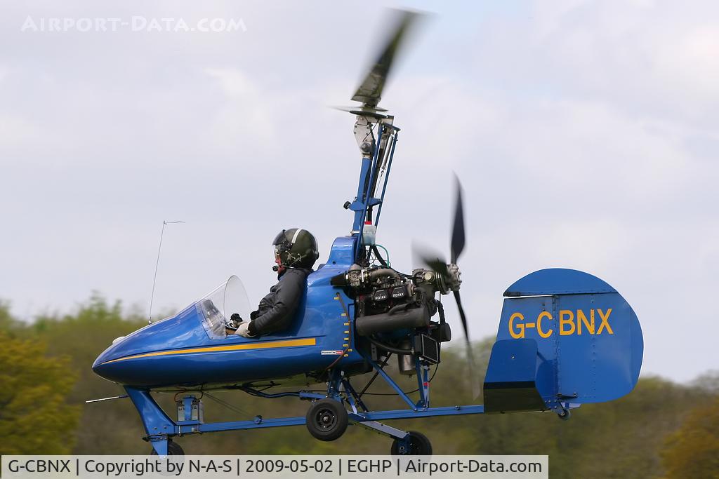 G-CBNX, 2002 Montgomerie-Bensen B-8MR Gyrocopter C/N PFA G/01A-1345, Micro trade fair visitor