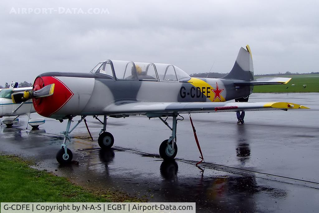 G-CDFE, 1985 Bacau Yak-52 C/N 855712, At a wet Turweston