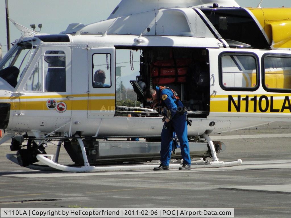 N110LA, 2005 Bell 412EP C/N 36392, Putting on hoist harnesses and getting ready to leave for a rescue