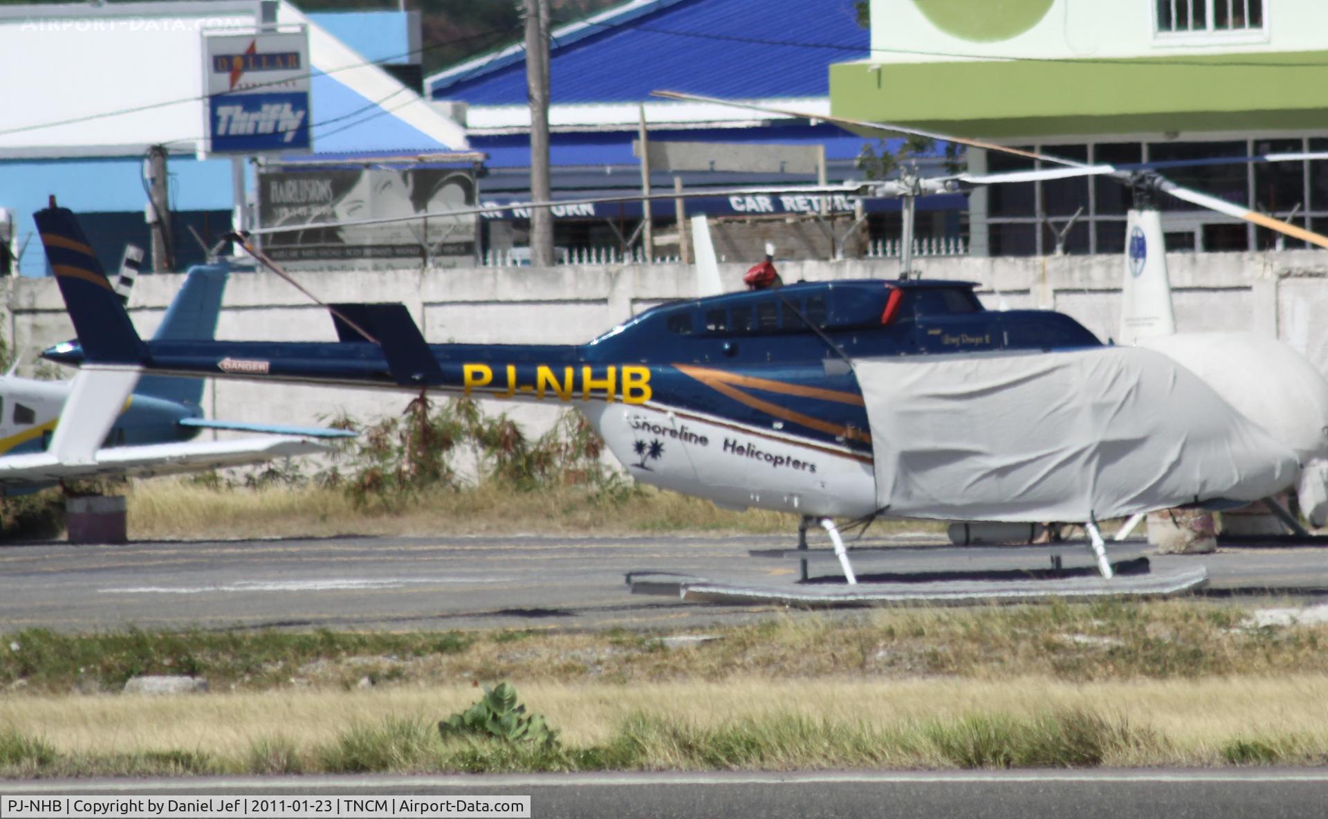PJ-NHB, 1981 Bell 206L-1 LongRanger II C/N 45661, PJ-NHB parked on the heli pad at TNCM