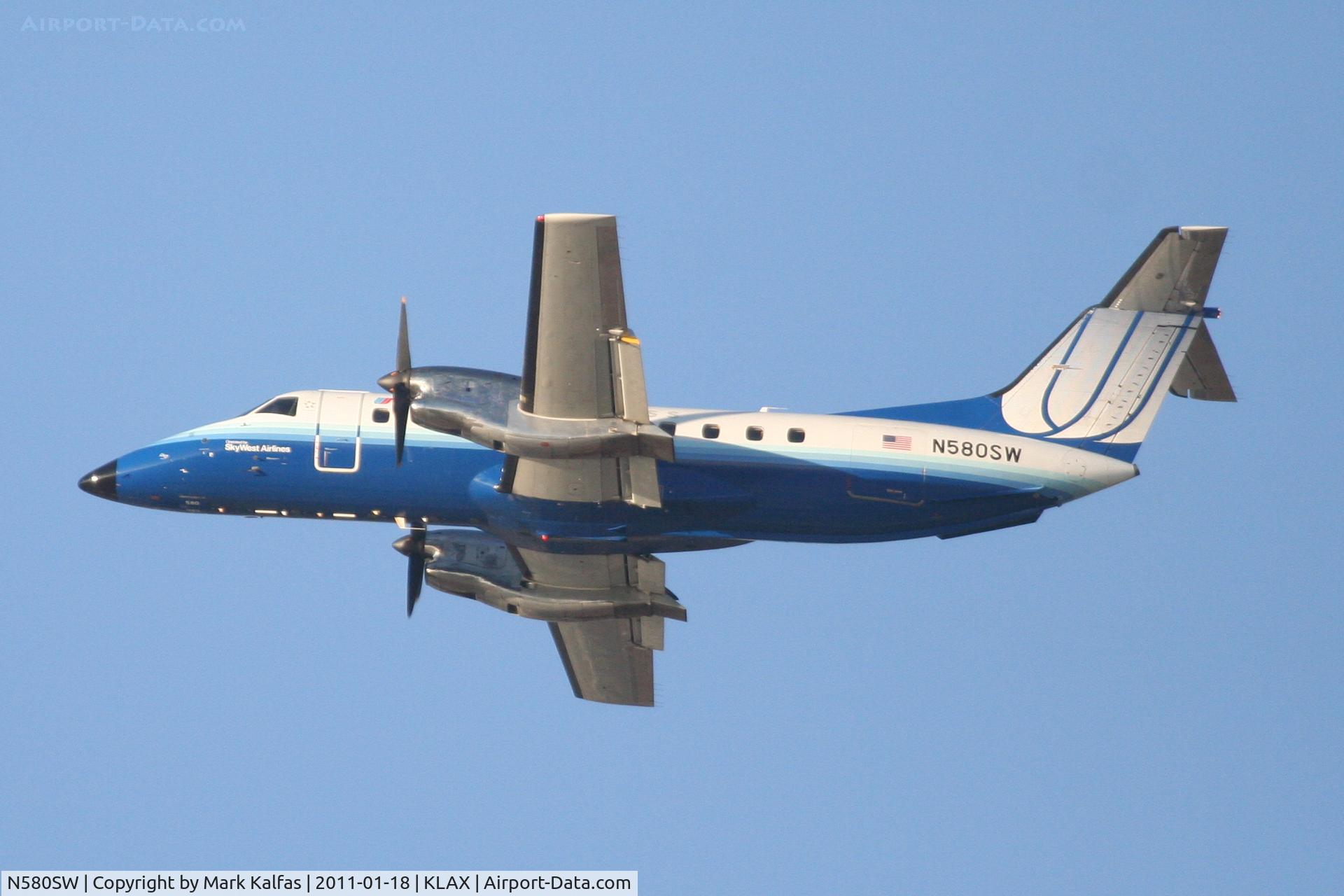 N580SW, 1999 Embraer EMB-120ER Brasilia C/N 120348, SkyWest/ United Express Embraer EMB-120ER, SKW6397 departing RWY 25R KLAX, enroute to KSBP.