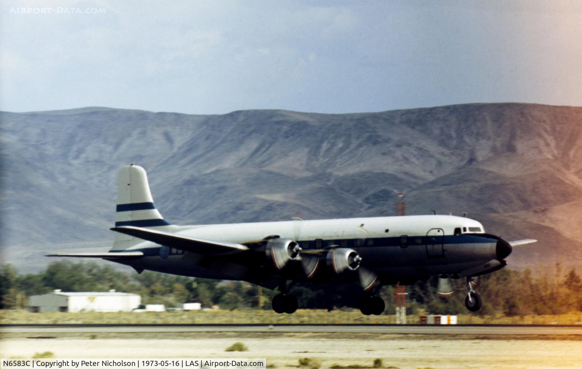 N6583C, 1957 Douglas DC-6B C/N 45219, DC-6B previously operated by Northeast Airlines landing at Las Vegas in May 1973.