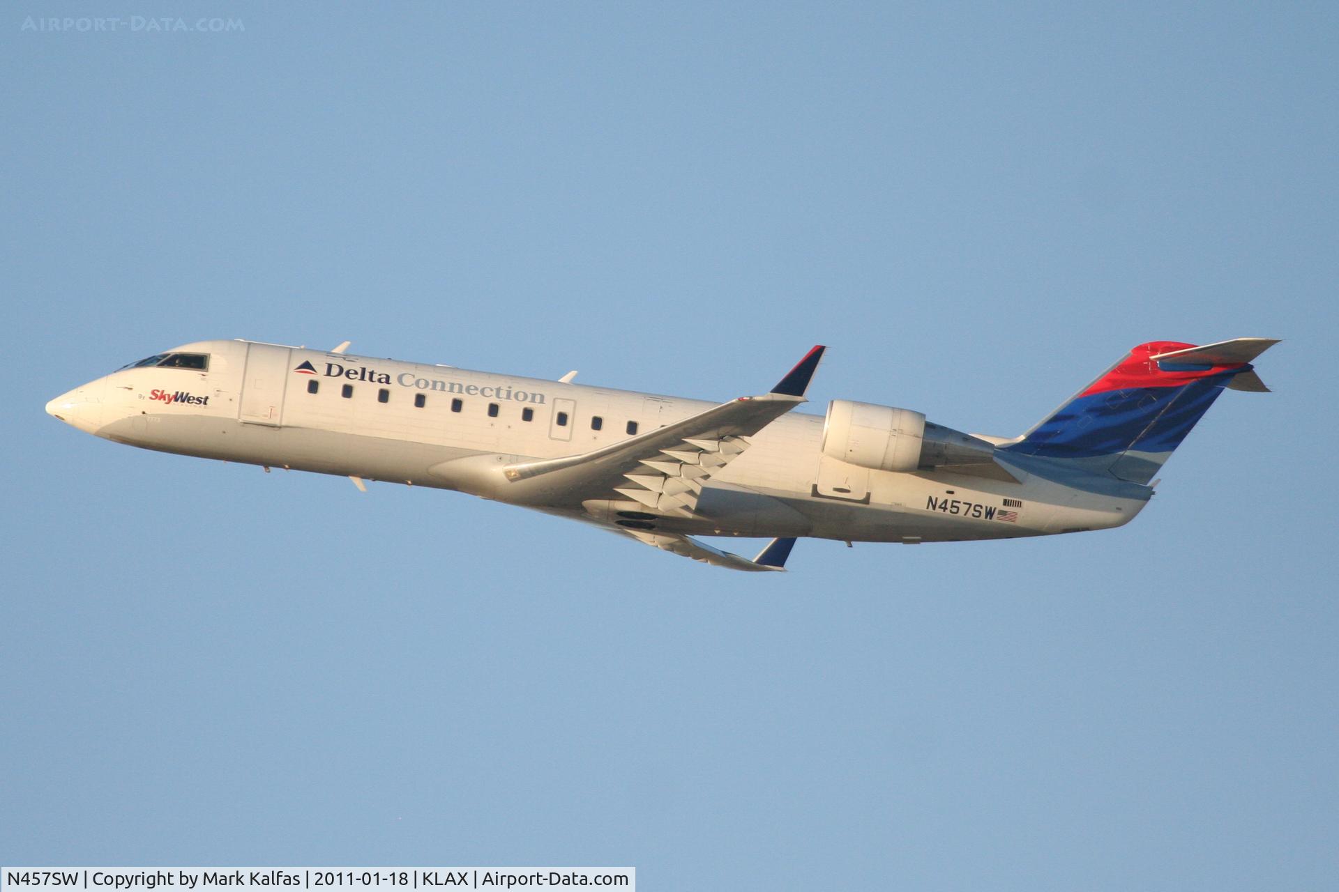 N457SW, 2003 Canadair CL-600-2B19 Regional Jet CRJ-200LR C/N 7773, SkyWest/Delta Connection Bombardier CL-600-2B19, SKW4787 departing RWY 25R KLAX enroute to KSAN.