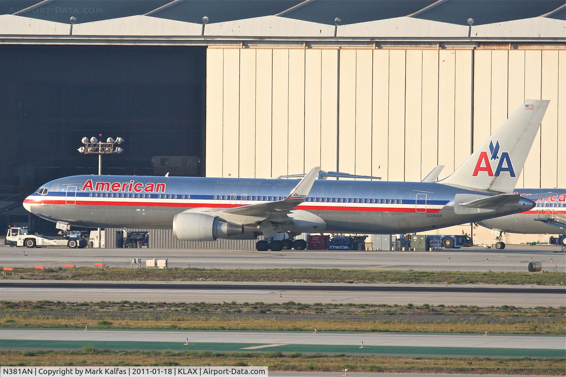 N381AN, 1993 Boeing 767-323 C/N 25450, American Airlines Boeing 767-323, getting a tow to the AA maintenance hangar at KLAX.