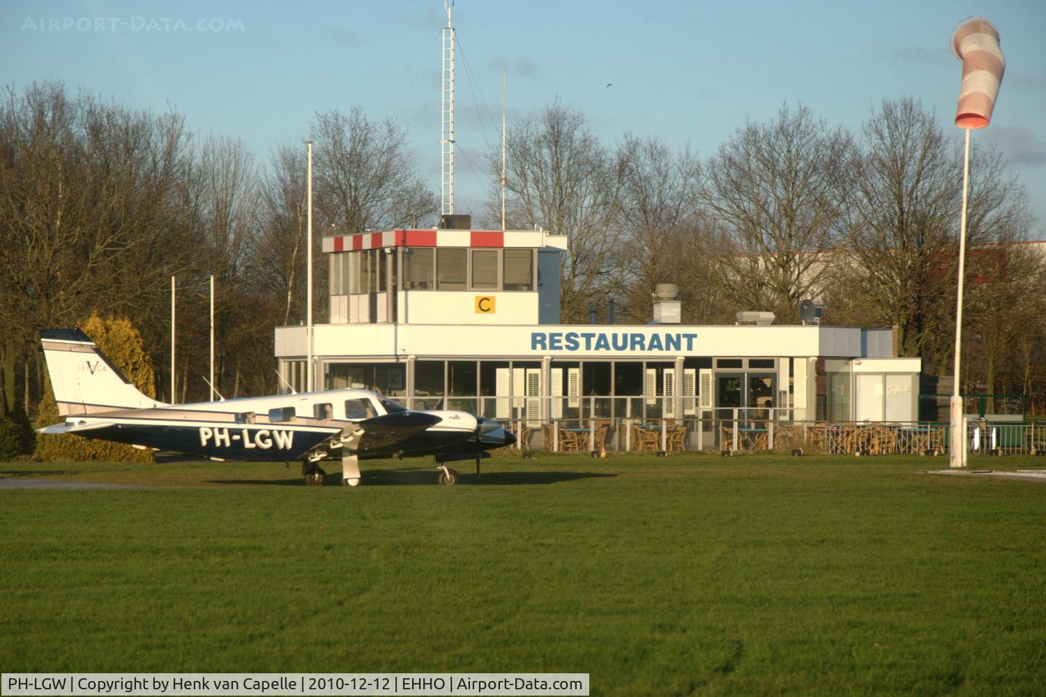 PH-LGW, Piper PA-34-220T V C/N 3449107, Piper Seneca V in front of the restaurant and tower of Hoogeveen airfield in the Netherlands.