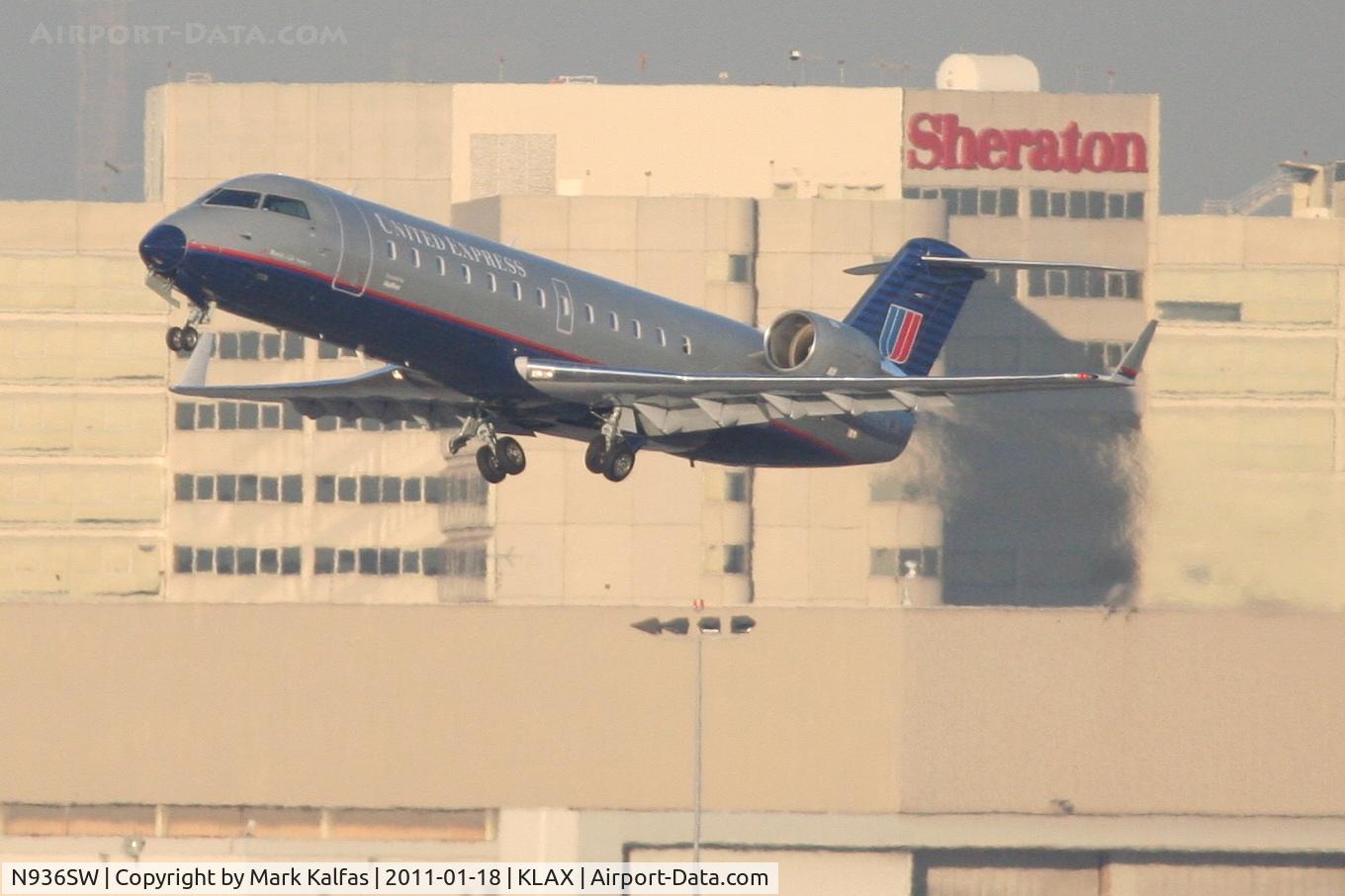N936SW, 2002 Bombardier CRJ-200LR (CL-600-2B19) C/N 7726, SkyWest/United Express Bombardier CL-600-2B19, SKW6490 departing RWY 25R KLAX enroute to KRNO.