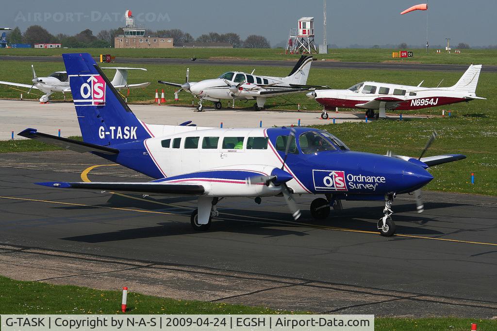 G-TASK, 1982 Cessna 404 Titan C/N 404-0829, Leaving the western apron