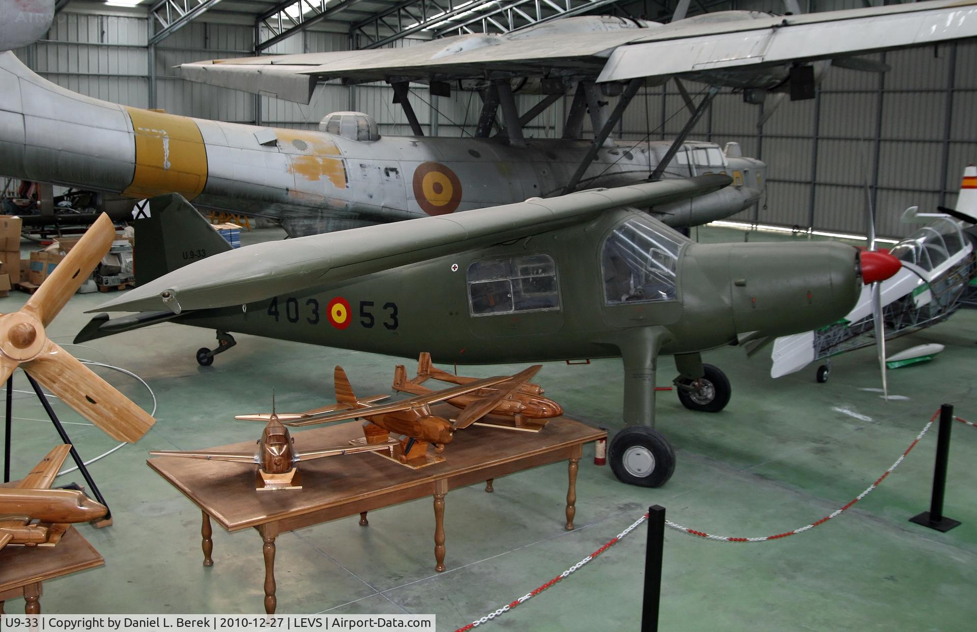 U9-33, CASA C-127 C/N 33, The CASA is the Dornier DO-27, designed and built in Spain.  An example undergoes restoration, with one of Claude Dornier's older creations in the background.