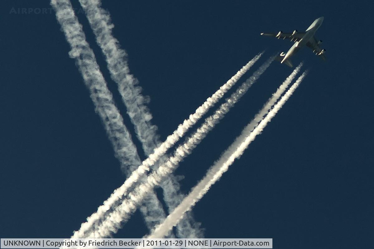 UNKNOWN, Contrails Various C/N Unknown, Cathay Pacific B747-400 crossing another huge contrail while cruising to Asia