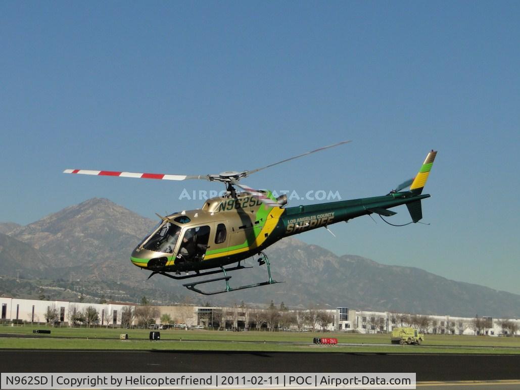 N962SD, 2001 Eurocopter AS-350B-2 Ecureuil Ecureuil C/N 3517, With clearance from the tower, ship heads west above taxiway Sierra and takes off