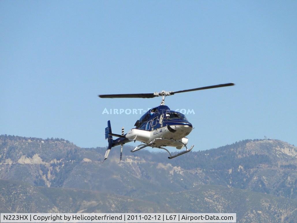 N223HX, 1984 Bell 222U C/N 47511, Entering Mercy Air parking area, fueling up and waiting for next call. This ship is used to transoport children to Loma Linda Hospital