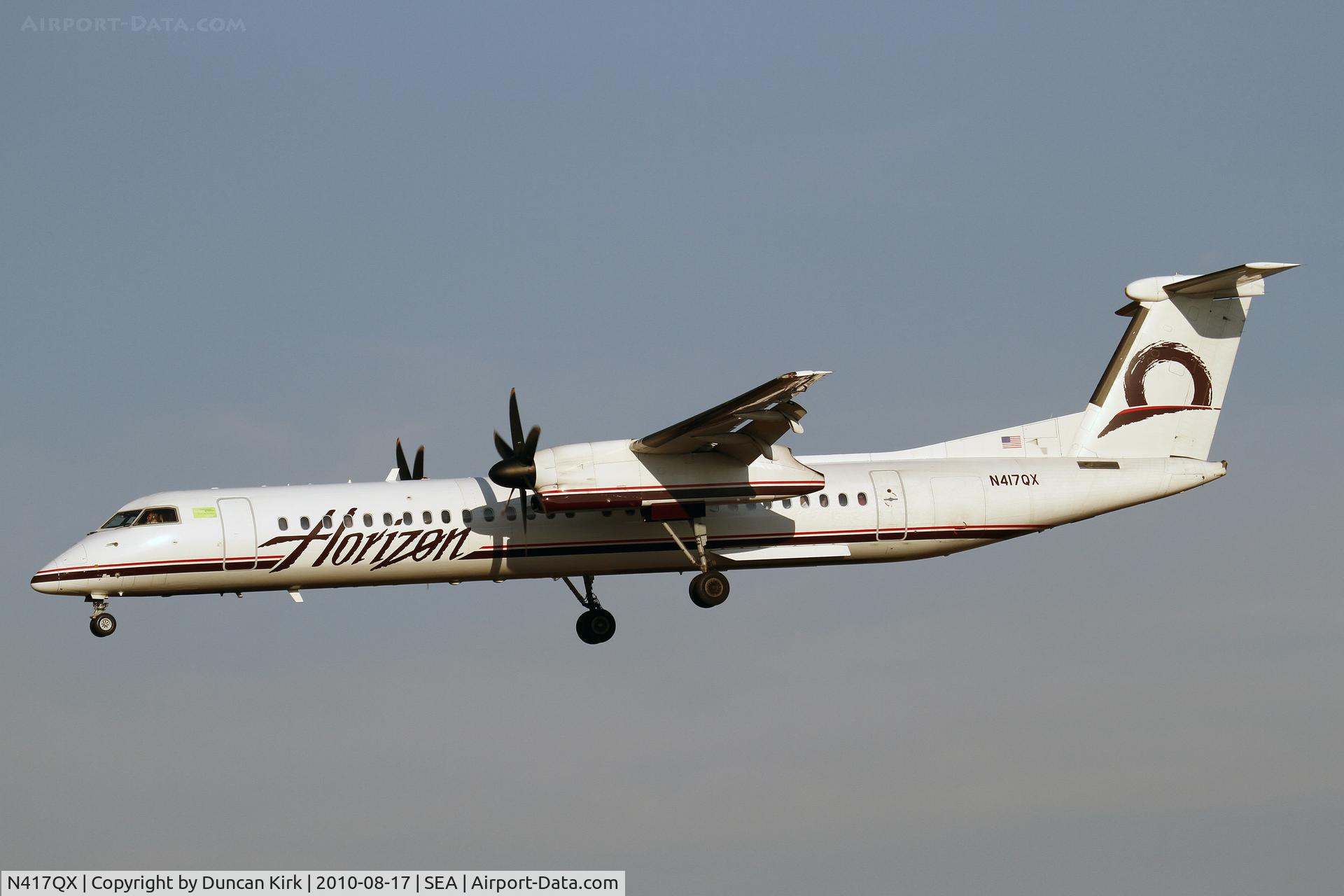 N417QX, 2004 De Havilland Canada DHC-8-402 Dash 8 C/N 4086, Landing on 34L